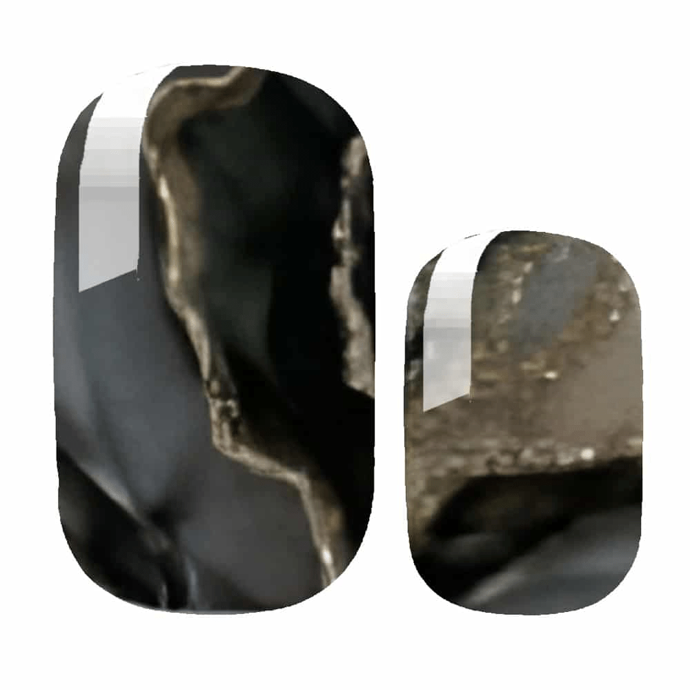 Close-up black marble gel nail wraps with metallic veining showing stone pattern detail
