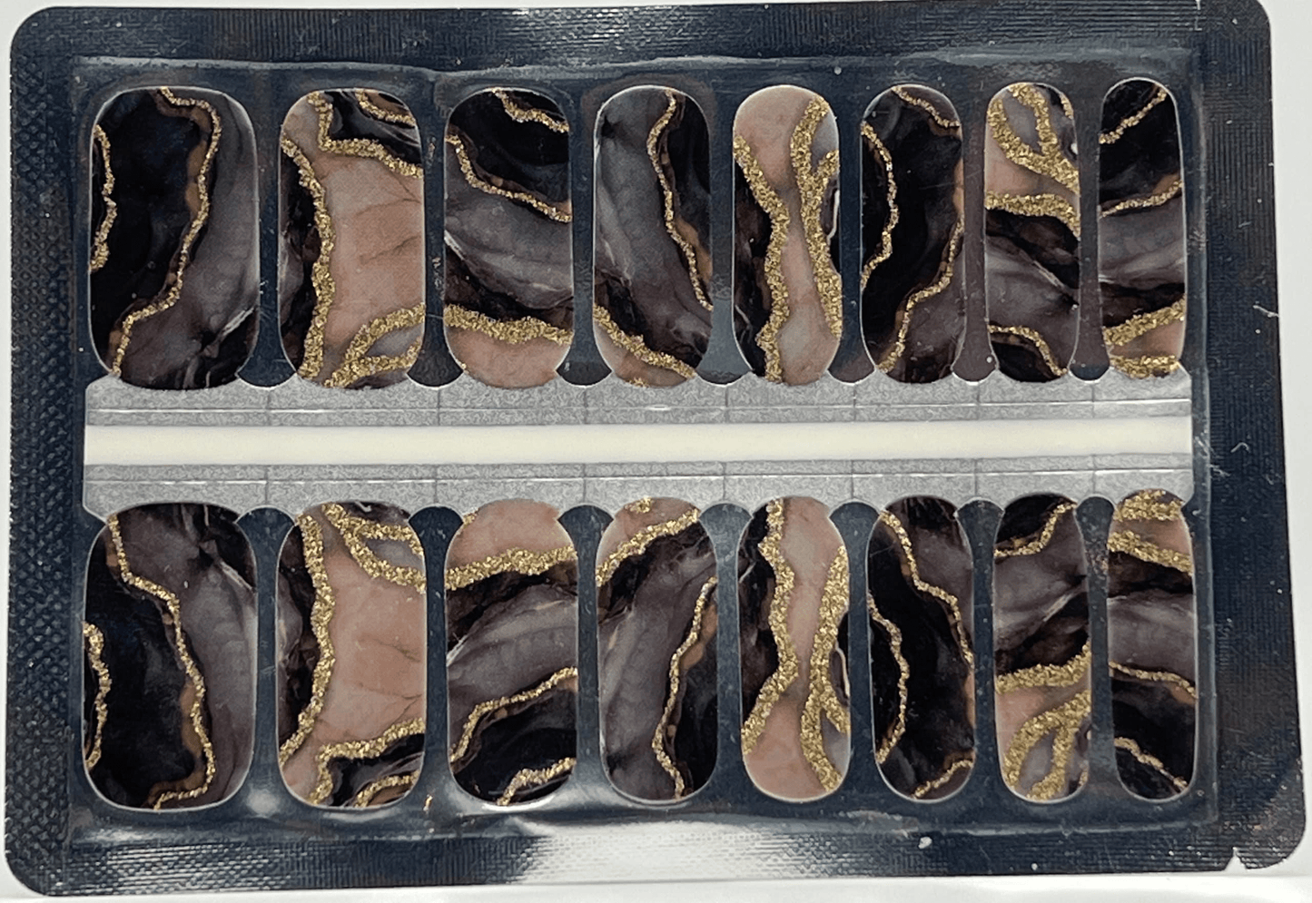 Metamorphic marble nail wraps sheet showing black and rose gold stone pattern designs