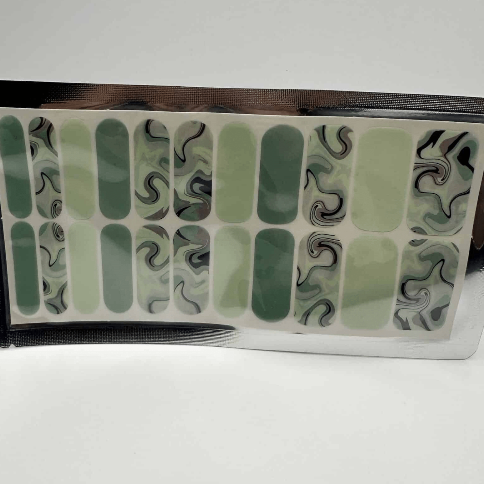 Green marble nail wraps sheet displaying 22 pieces with stone effect wave patterns for wide fit nails