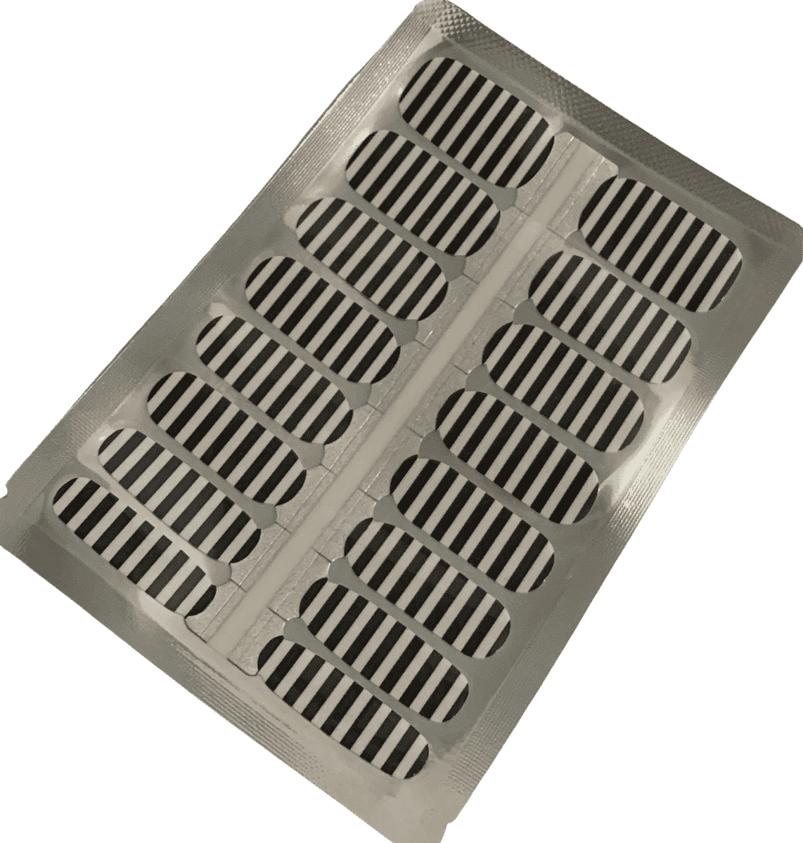 Sheet of black and white striped nail wraps ready for application