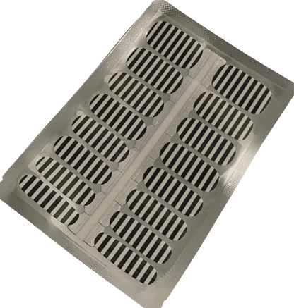 Sheet of black and white striped nail wraps ready for application