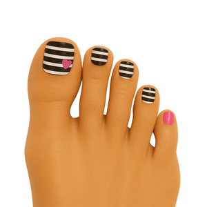Black and white striped pedicure nail wraps with pink heart accent on toes