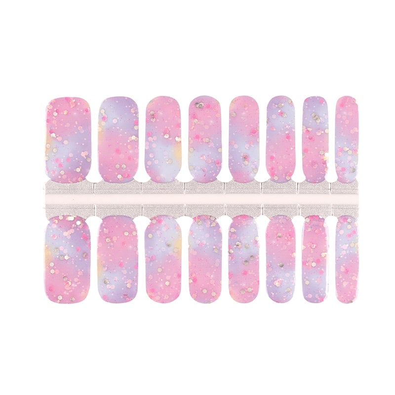 Pink purple gradient glitter nail wrap sheet showing cosmic ombre nail art designs