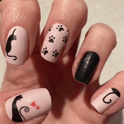 Cat themed gel nail wraps in pink and black with paw prints