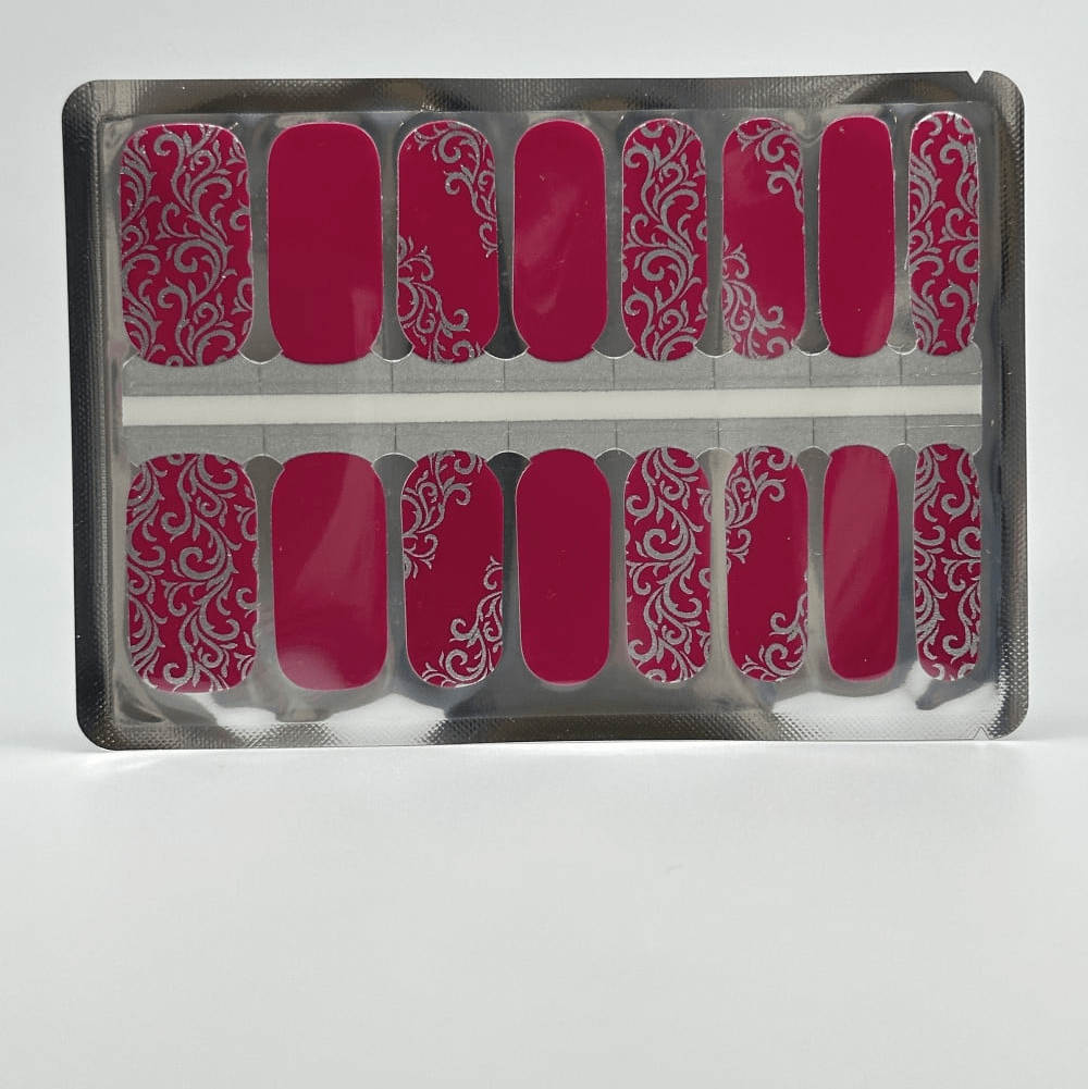 Purple nail wraps with silver baroque design in clear packaging sheet