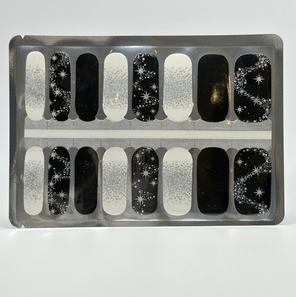 Black and silver star pattern nail wraps sheet showing celestial glitter gel nail designs