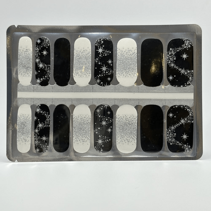 Black and silver star pattern nail wraps sheet showing celestial glitter gel nail designs
