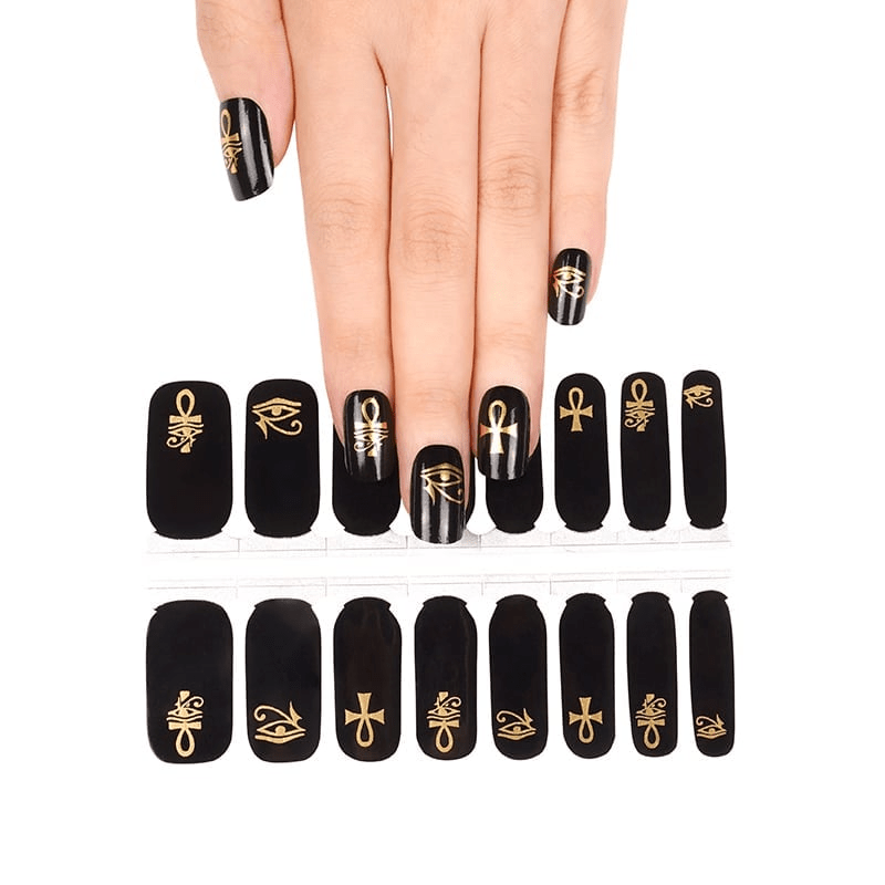 Non-UV nail wraps featuring black base with gold ankh and Egyptian symbols