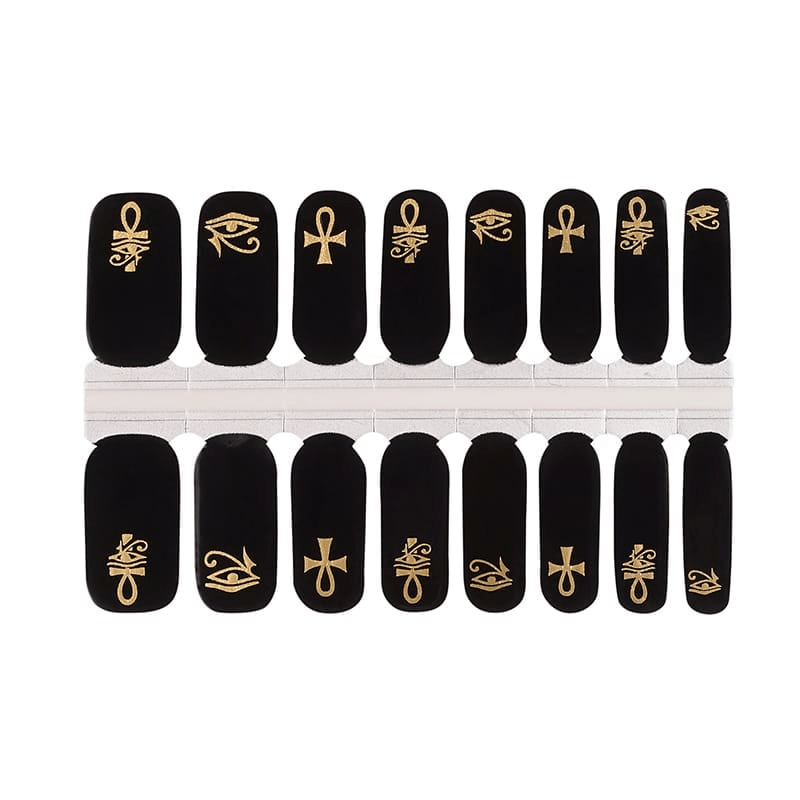 Egyptian nail wrap set with black background and gold hieroglyphic patterns