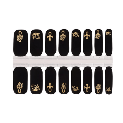 Egyptian nail wrap set with black background and gold hieroglyphic patterns