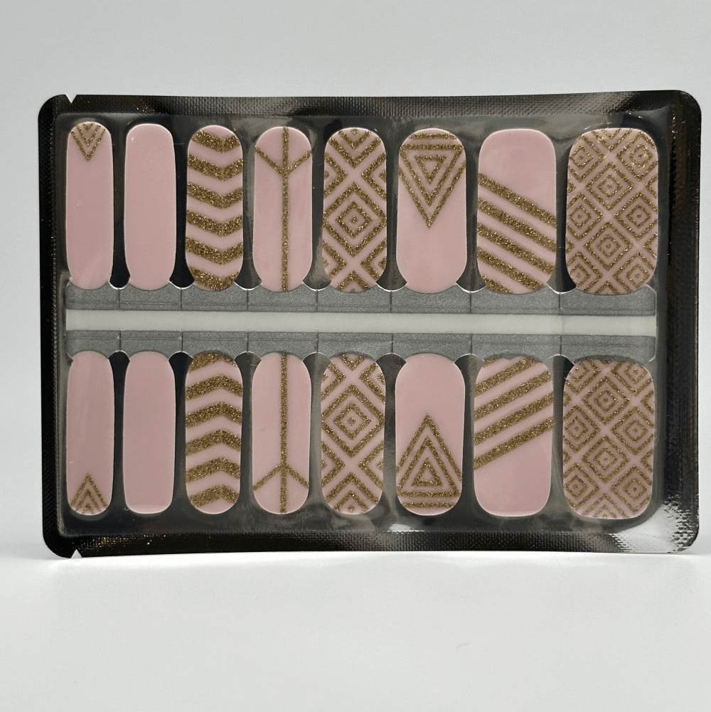 Pink and gold geometric nail wraps sheet showing chevron diamond patterns for at-home manicure