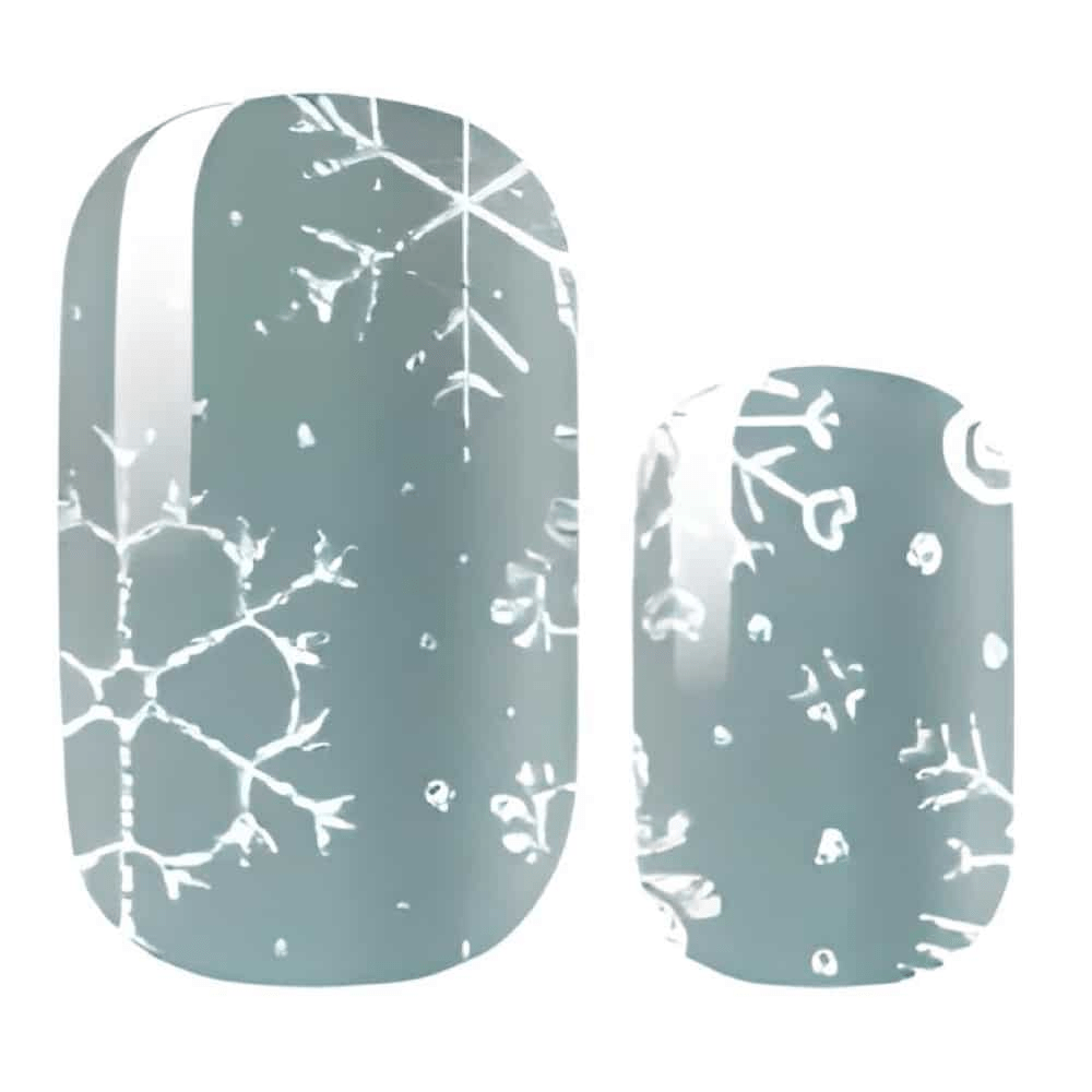 Winter snowflake nail wraps in pale blue with delicate white pattern design