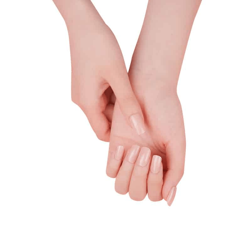 Close-up of hands wearing subtle peach gel nail wraps perfect for office appropriate manicure