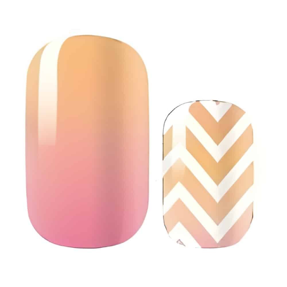 Peach pink ombre nail art wraps with white chevron geometric pattern close-up