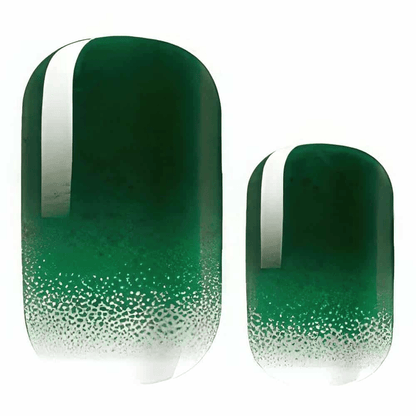 Two emerald green gradient nail wrap samples with silver glitter fade effect