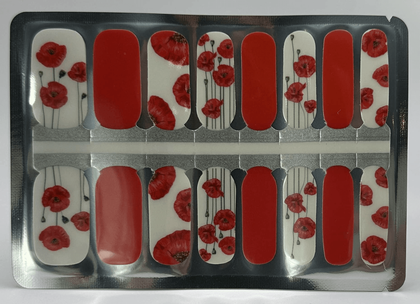 Red poppy floral nail wraps with white background in classic manicure design