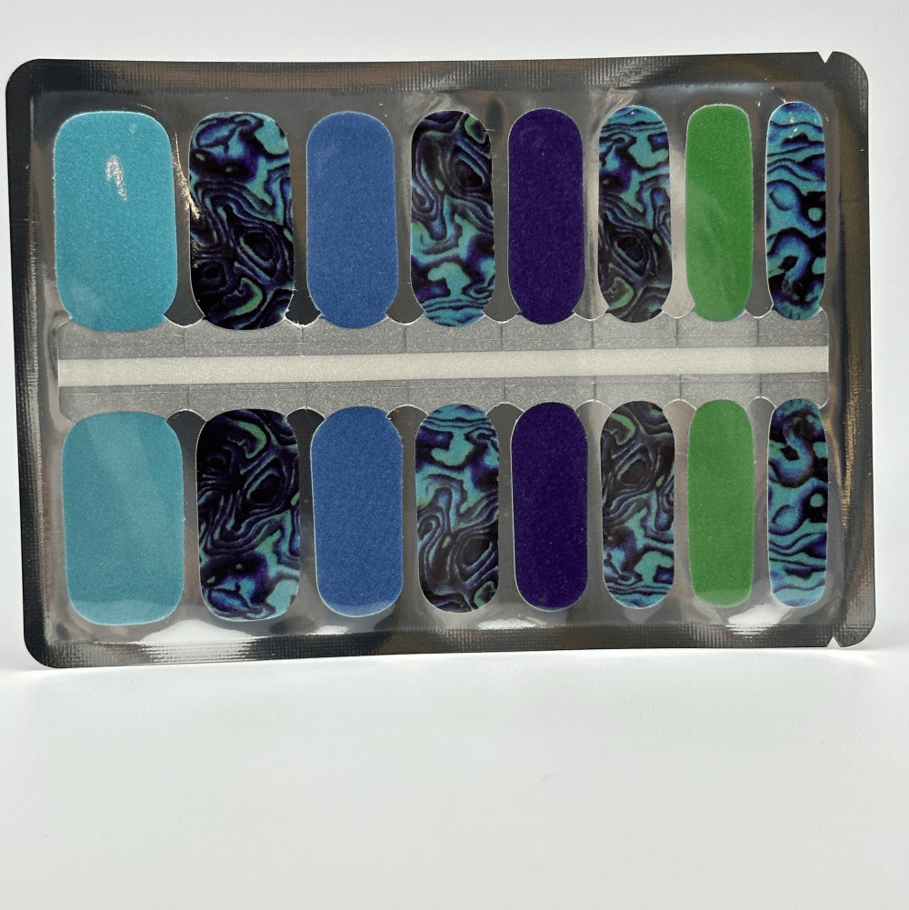 Blue teal and green marble nail wraps set showing ocean-inspired patterns