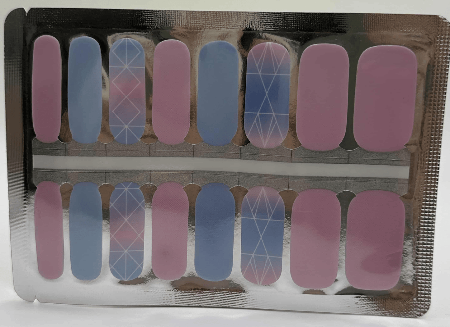 Prismatic gradient nail wraps sheet featuring pink blue ombre with geometric white line patterns