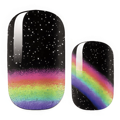 Galaxy rainbow nail wrap design with black starry background and holographic gradient