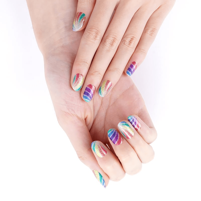 Colourful rainbow swirl nail wraps on hands displaying bright psychedelic pattern for at-home manicure
