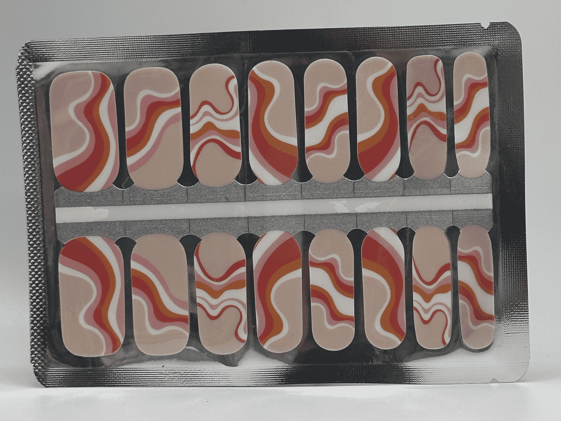 Coral pink marble swirl nail wraps with cream abstract pattern for at-home manicure