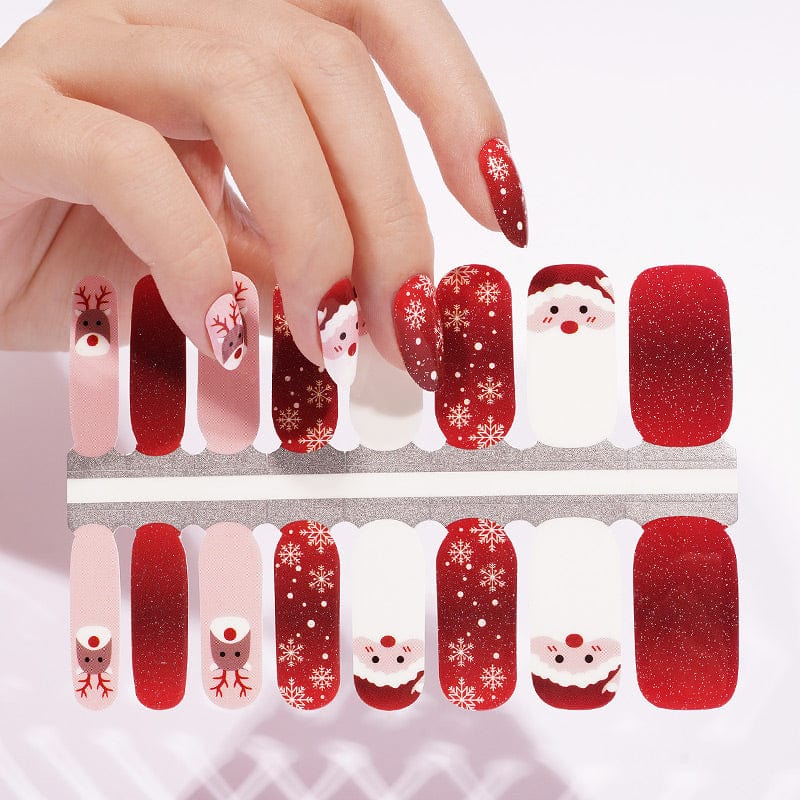 Christmas nail wrap sheet showing Santa, reindeer and red glitter nail designs