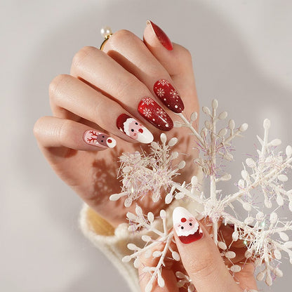 Festive red and white Christmas nail art with Santa and reindeer characters