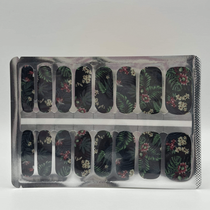 Sheet of jungle print nail wraps with tropical leaves and flowers in packaging