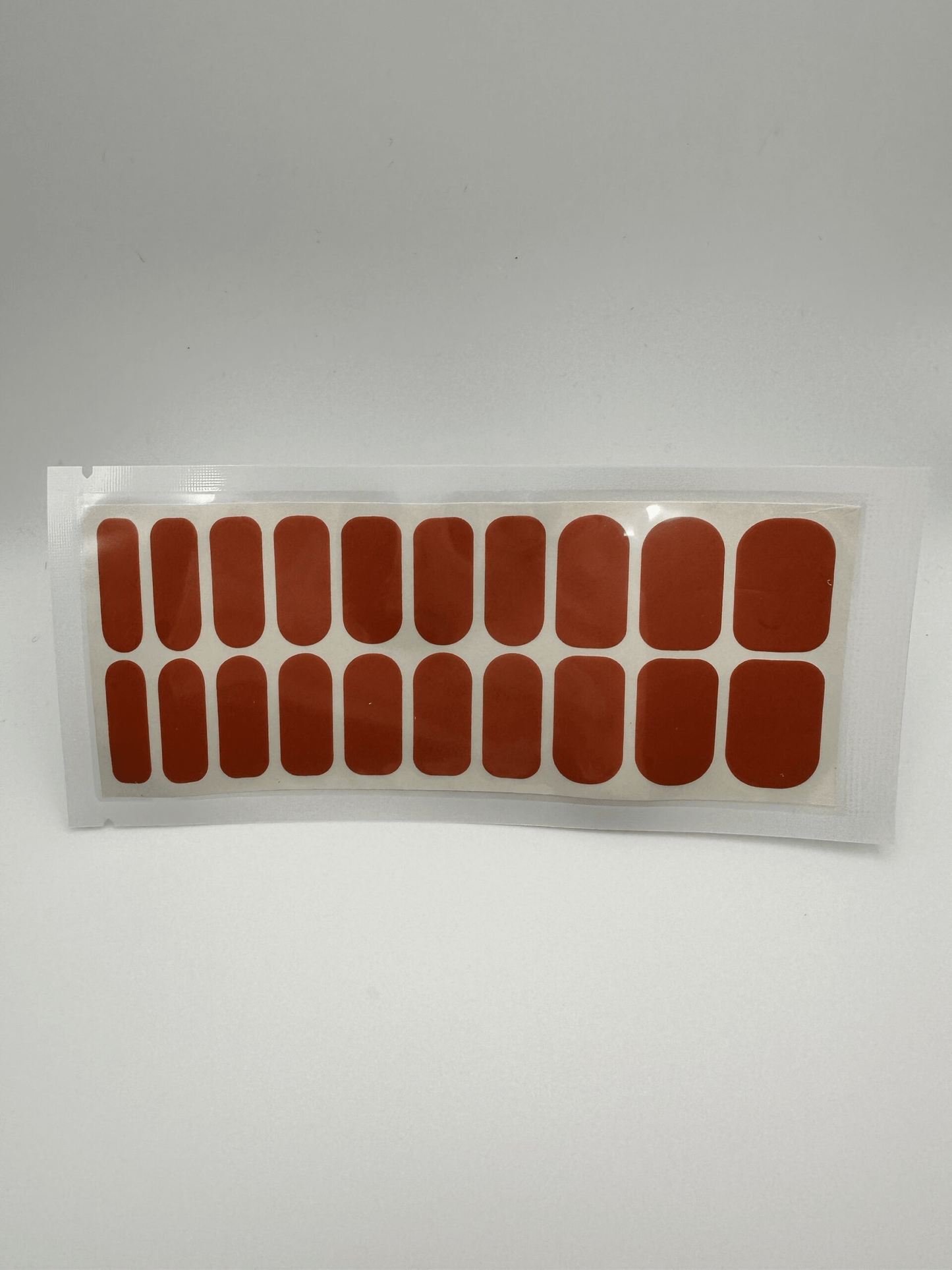 Wide fit rust nail wrap pack containing 20 piece burnt orange manicure wraps