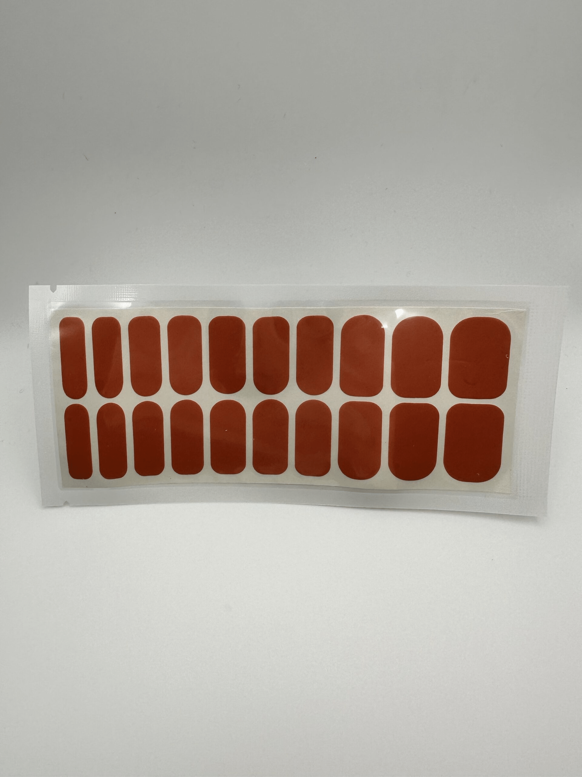 Wide fit rust nail wrap pack containing 20 piece burnt orange manicure wraps