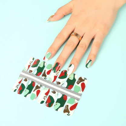 Sage and russet botanical nail wraps with autumn leaves and berries on hand
