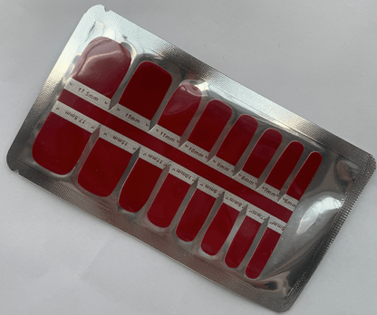 Non-UV burgundy pedicure wraps in silver foil packaging showing wine red nail art