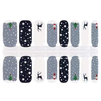 Christmas nail wraps sheet showing festive patterns with snowflakes, reindeer, trees in navy and grey