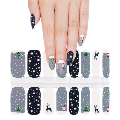 Festive nail wrap sheet with Christmas reindeer, snowflakes, winter holiday patterns