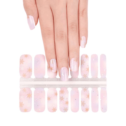 Non-UV nail wraps sheet showing pink gradient snowflake design for at-home manicure application