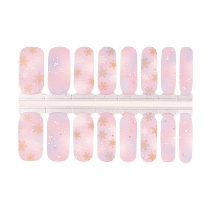 Pink and lilac ombré nail wraps with gold and white snowflakes, glitter accents