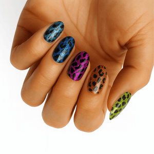 Colourful leopard print gel nail wraps on hand featuring rainbow animal print nail art
