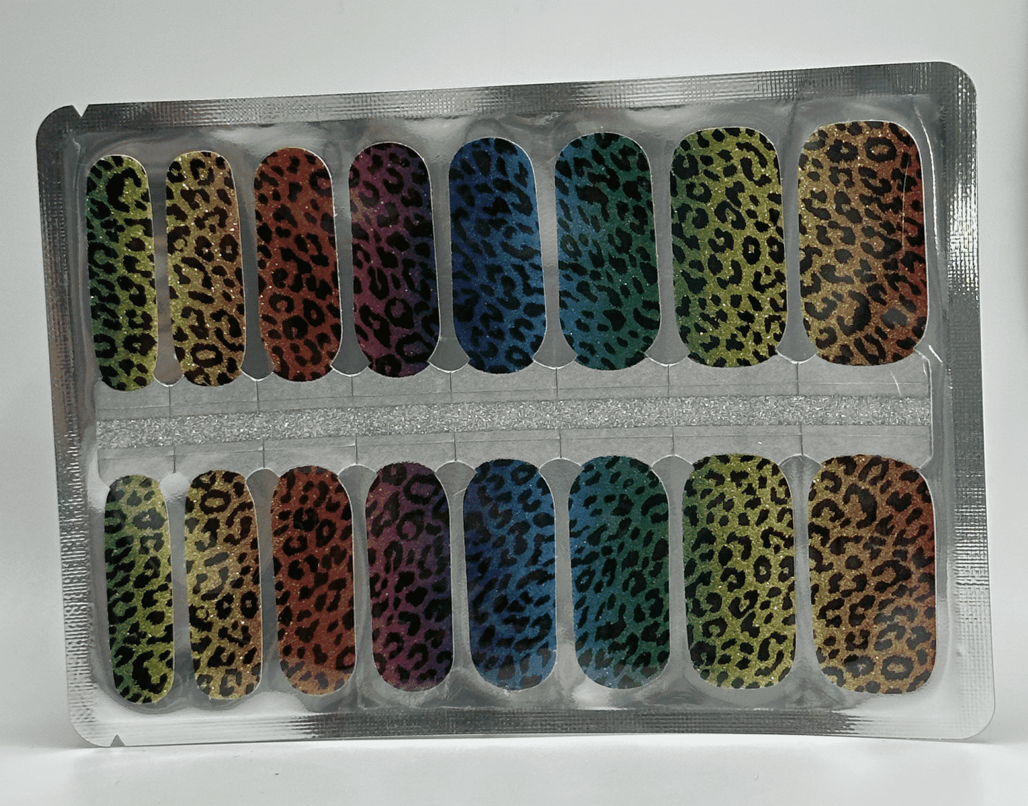 Rainbow leopard print nail wrap sheet showing multicoloured animal print nail art designs