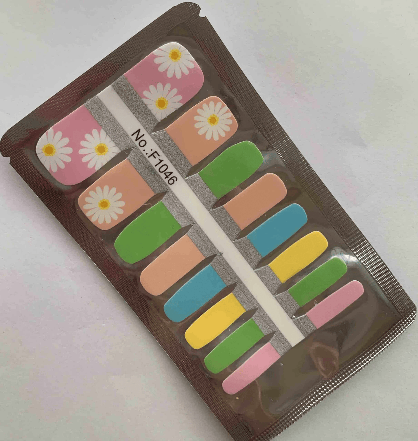 Non-UV pedicure wraps packaging showing daisy floral designs in pastel spring colours