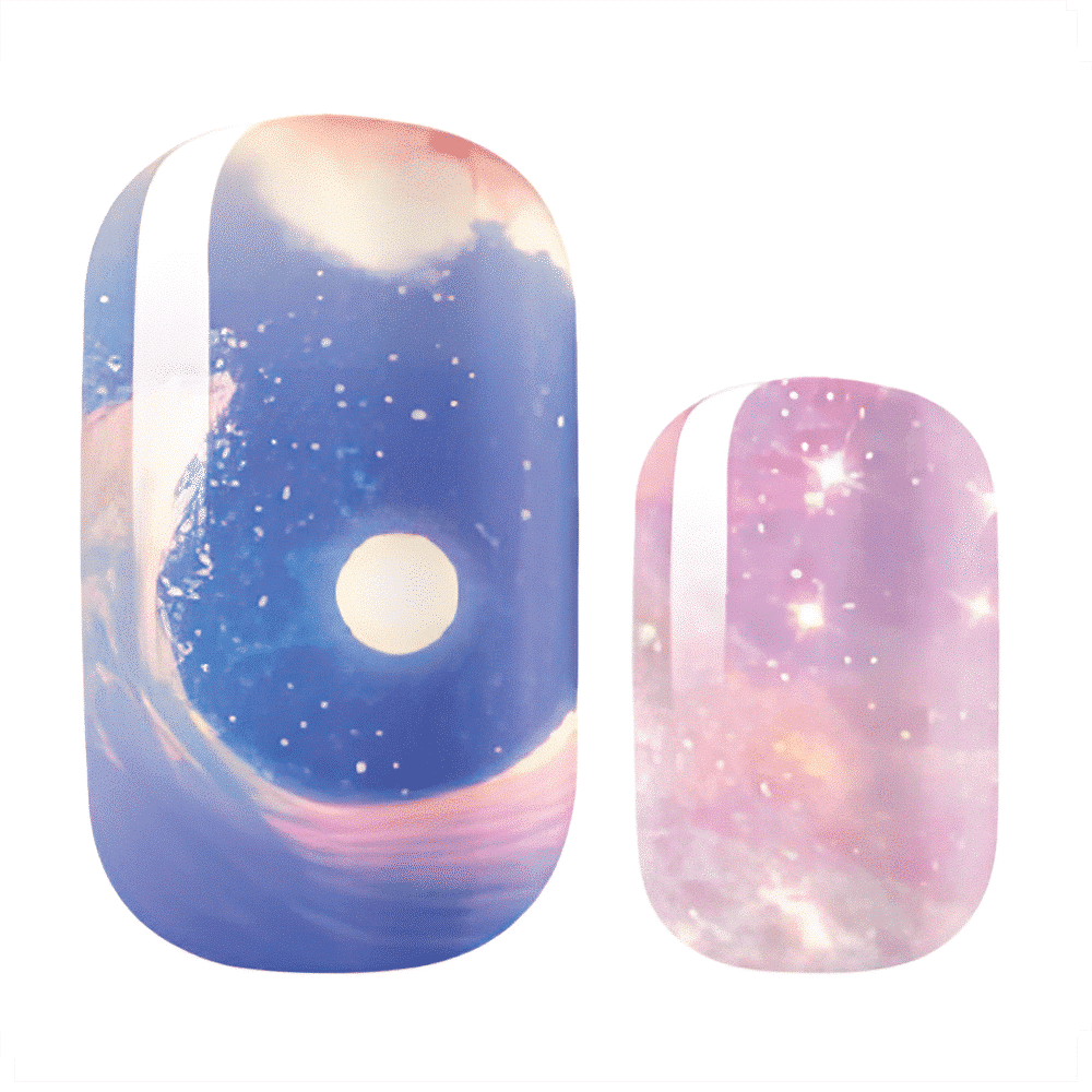 Blue pink galaxy nail wraps with stars and cosmic swirl pattern close-up
