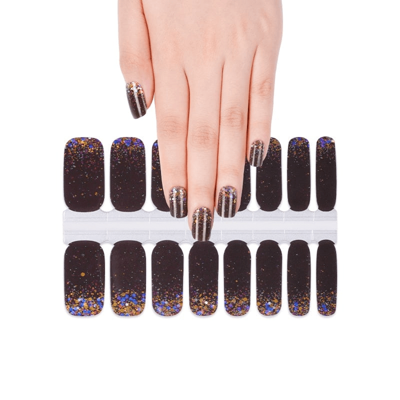 Hand displaying black glitter nail wraps sheet with rainbow confetti pattern design