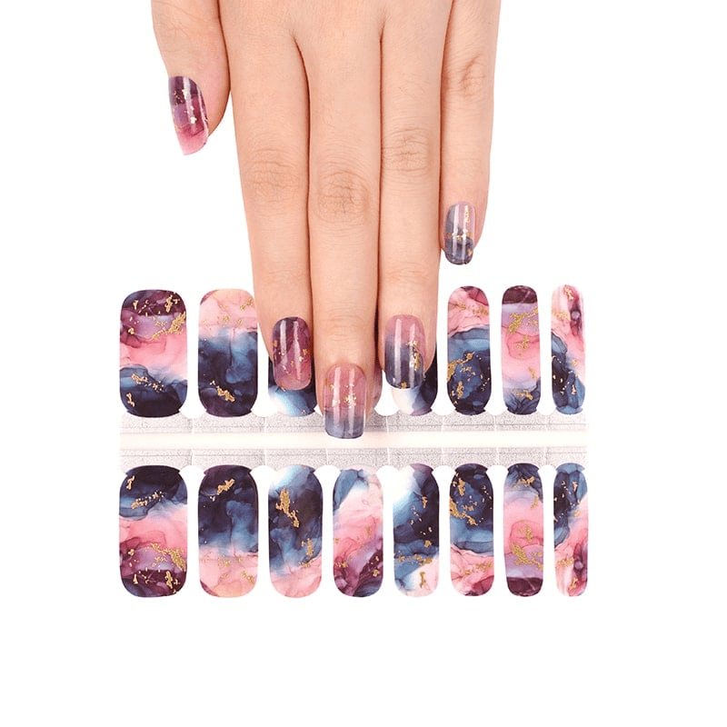 Hand showing watercolour marble nail wraps with pink navy abstract stone design