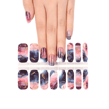 Hand showing watercolour marble nail wraps with pink navy abstract stone design