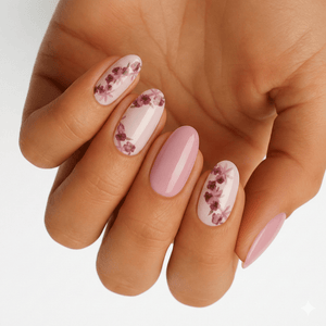 Pink floral nail wraps with burgundy roses on hand showing dusty rose manicure