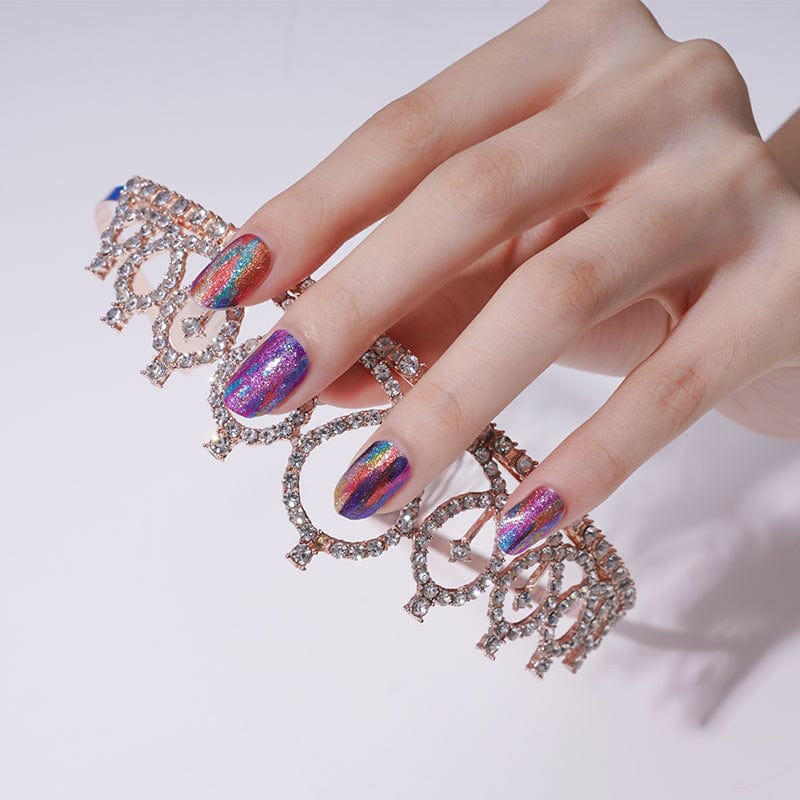 Statement hand with multicolour watercolour nail art and crystal ring accessories