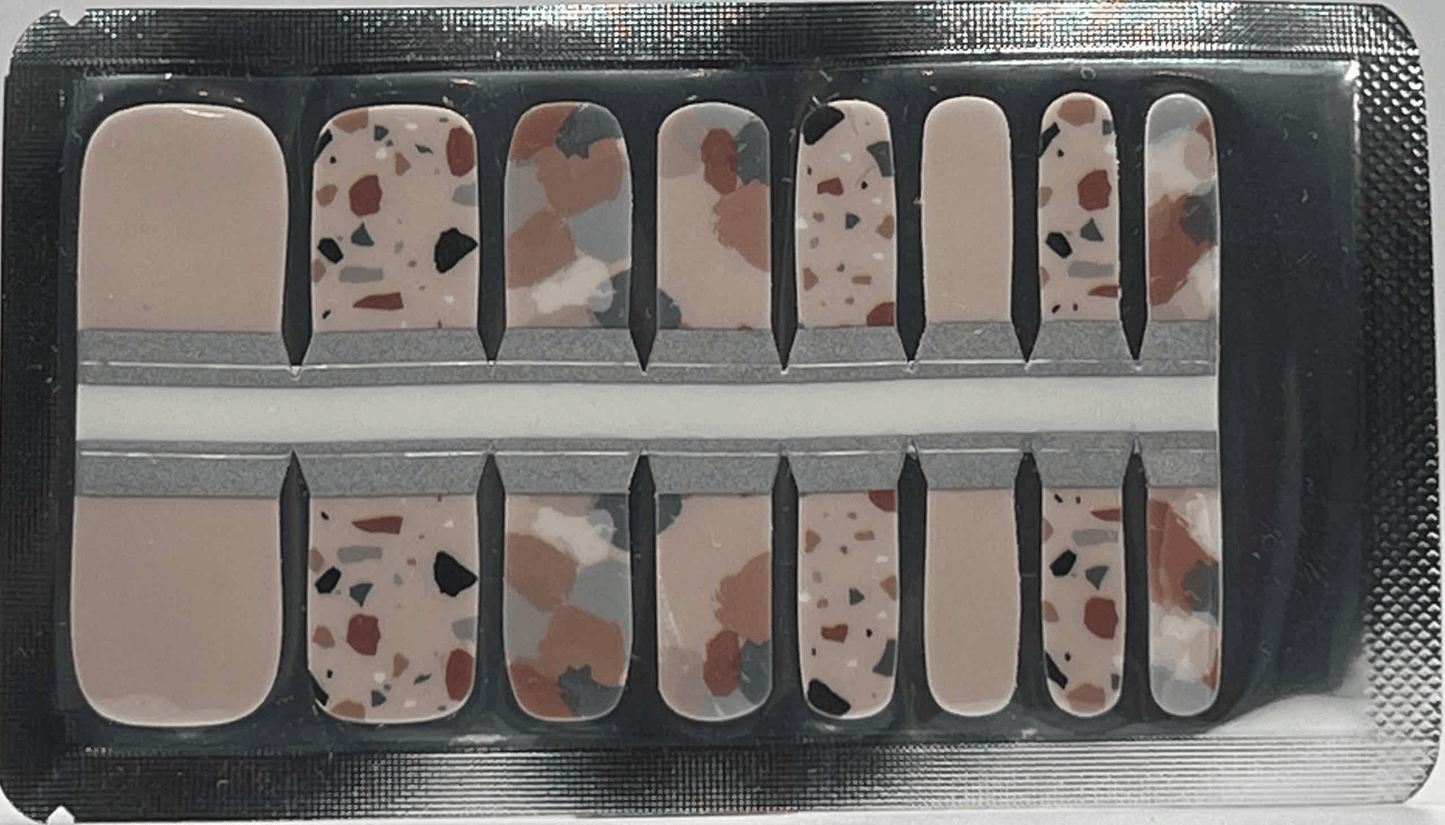 Terrazzo pedicure nail wraps sheet showing speckled stone pattern in neutral earth tones