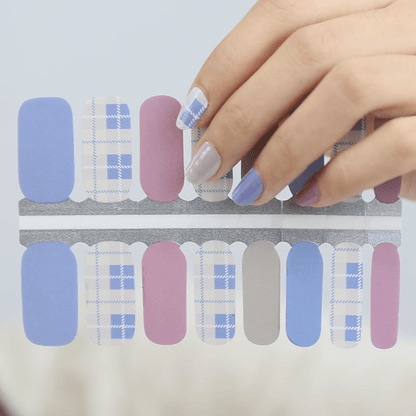 Tartan plaid nail wraps sheet showing blue pink Scottish pattern designs for at-home manicure