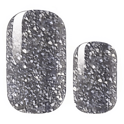 Close-up silver glitter gel nail wraps with reflective metallic chrome texture design