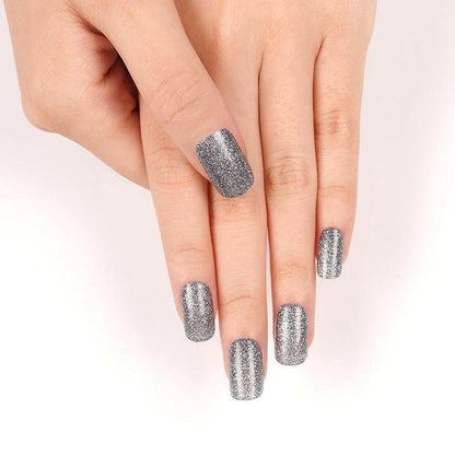 Silver glitter nail wraps showing chrome metallic finish on hand against white background