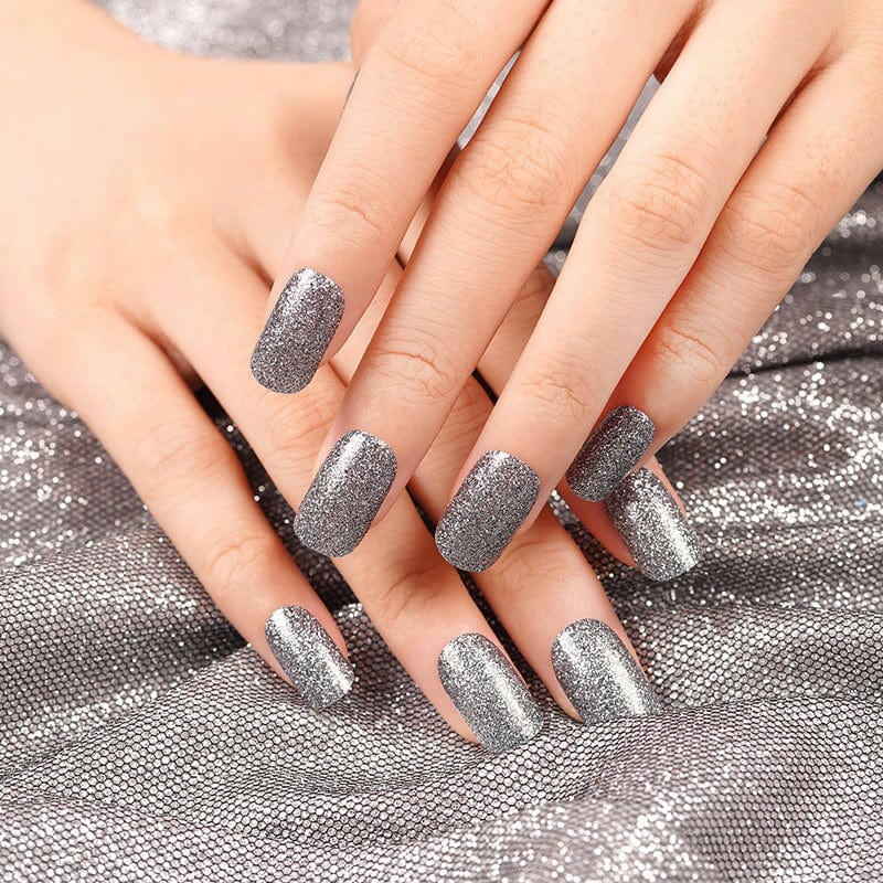 Silver metallic nail wraps with mirror chrome finish applied on both hands